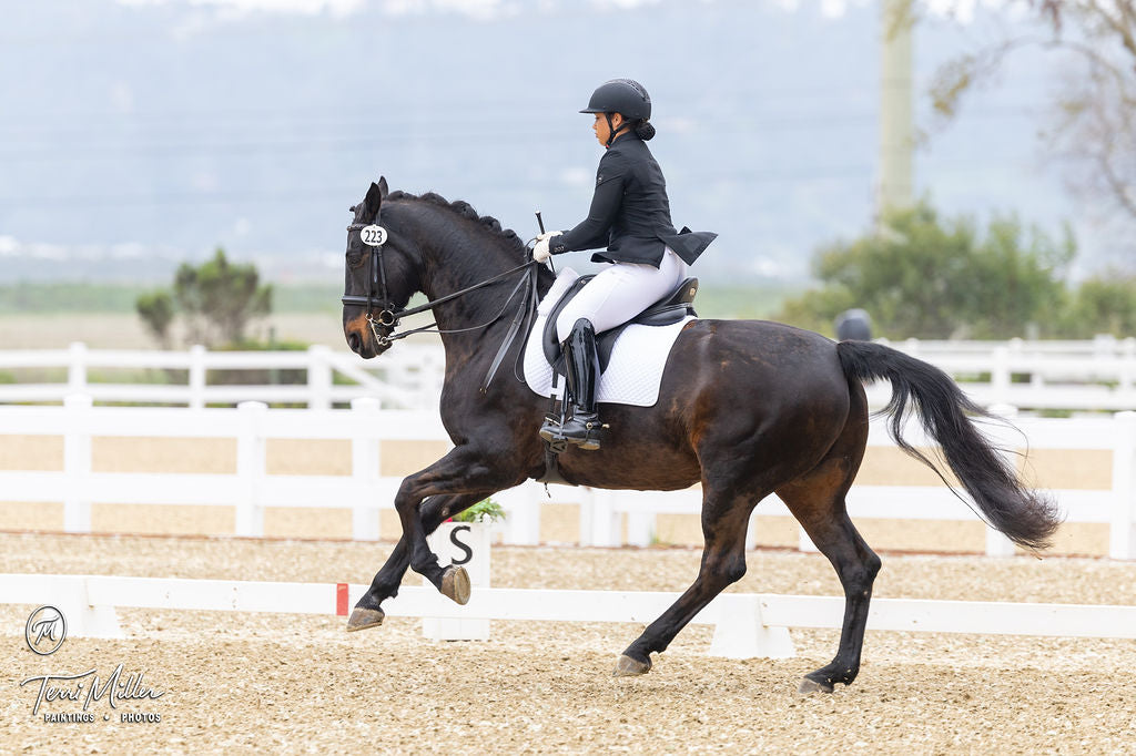 Emme Chisholm competing in Divine Equestrian White Dignified Competition Breeches
