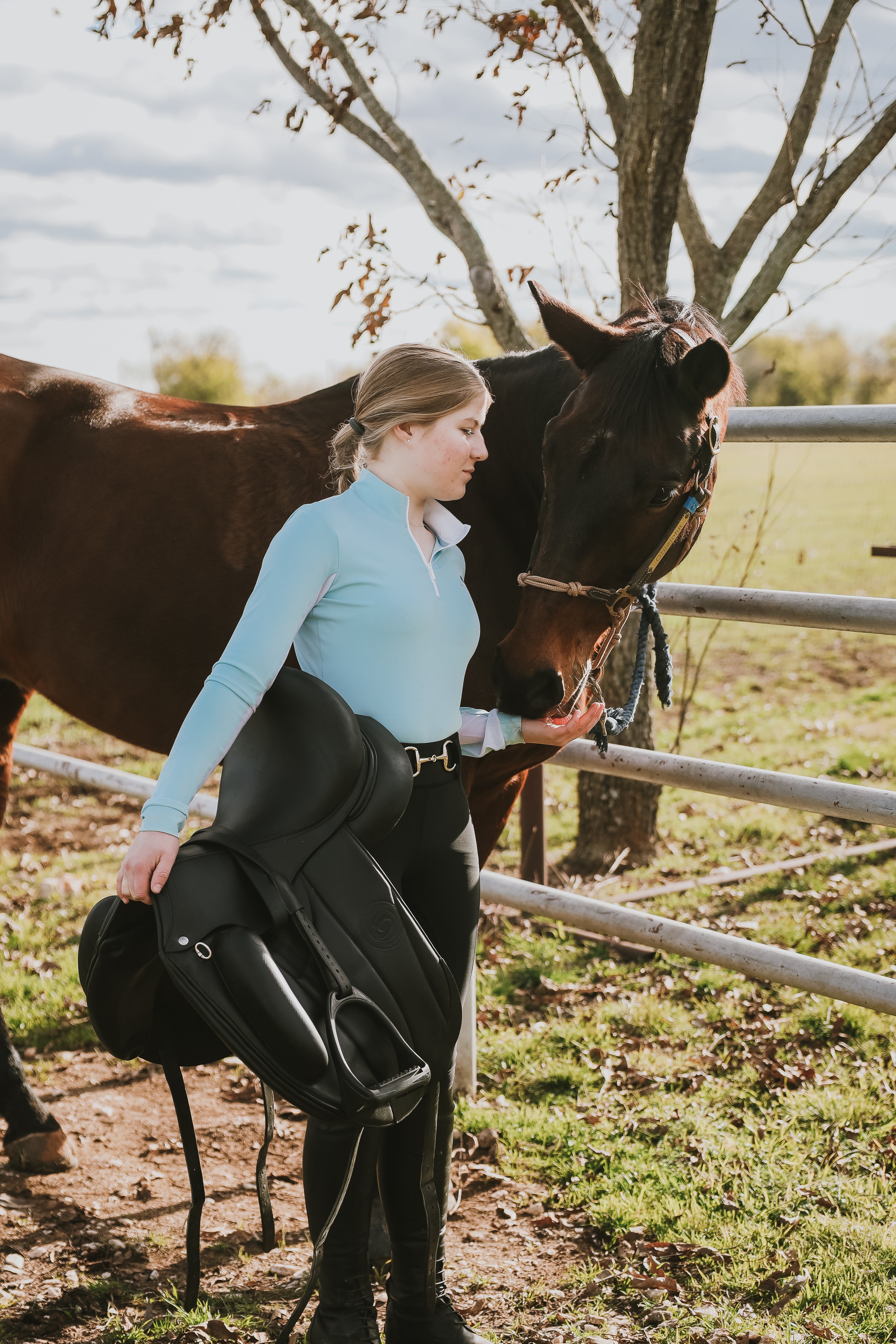 Finley Wright wearing Divine Equestrian Sky Blue Sweet Lady Sun Shirt, Black Comfort Fit Belt, and Black Comfort Grip Leggings