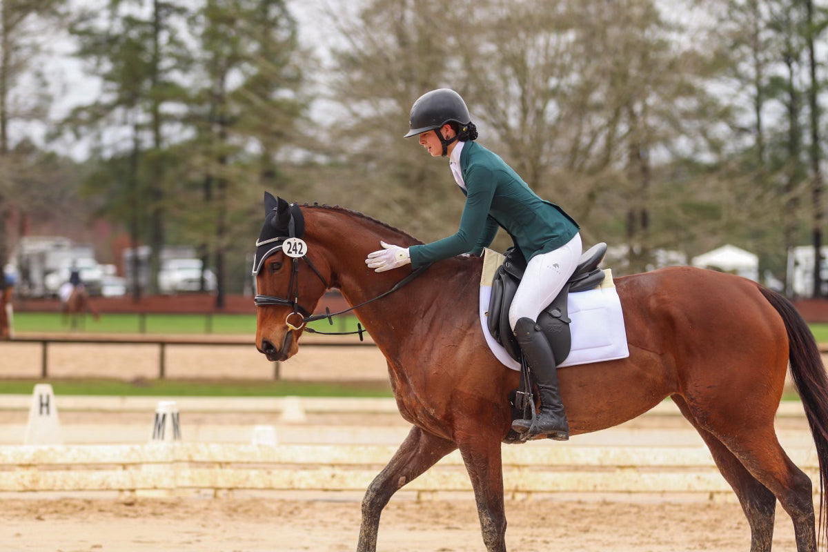 Divine Equestrian Sponsored Rider Sutton Wetcher wearing the White Comfort Grip Leggings and White Sweet Lady Sun Shirt