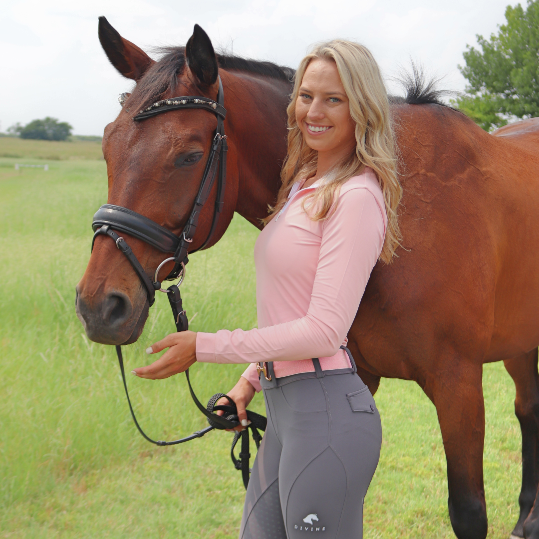 Anna Pierce wearing Divine Equestrian Pink Sweet Lady Sun Shirt, Unicorn Pink Comfort Fit Belt, and Gray Comfort Grip Leggings
