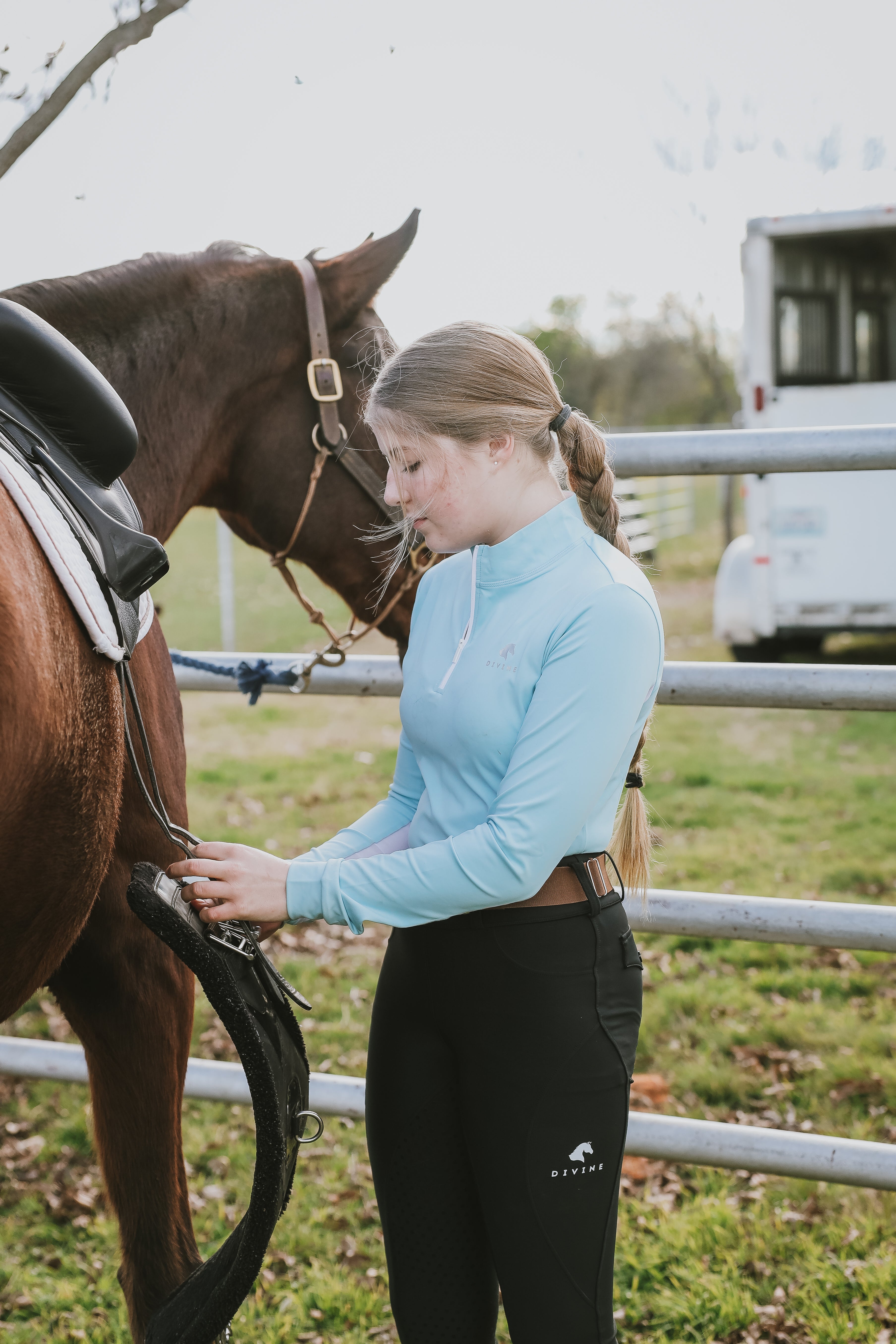 Finley Wright wearing Divine Equestrian Sky Blue Sweet Lady Sun Shirt and Black Comfort Grip Leggings