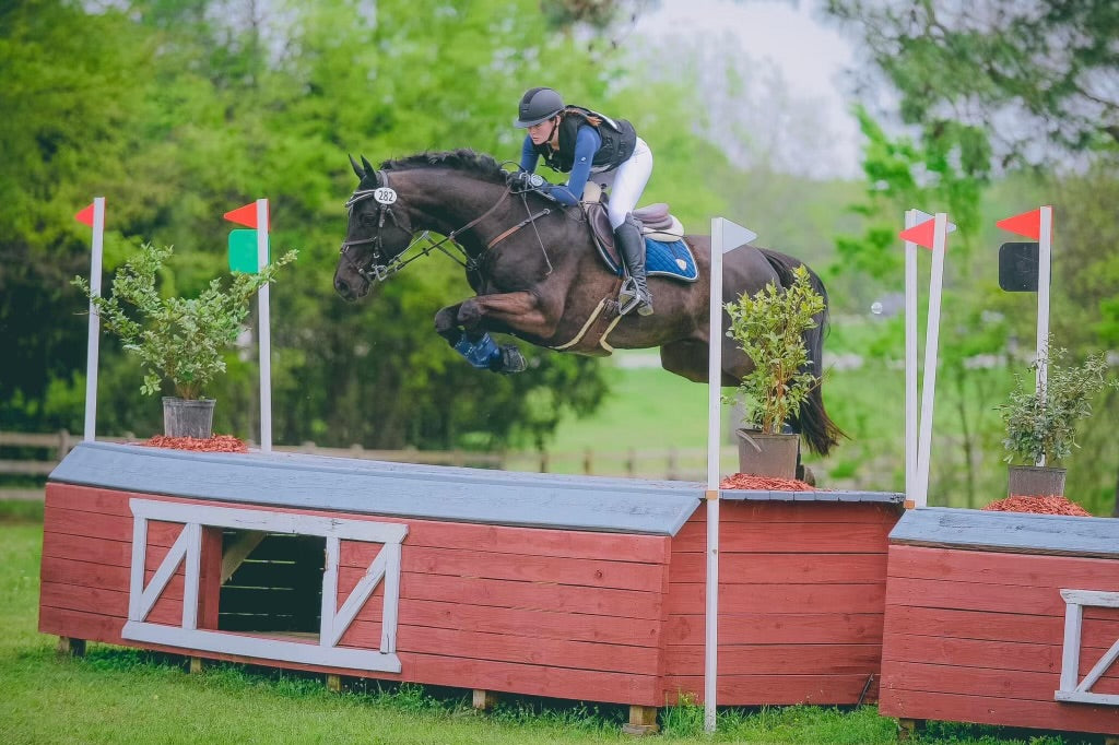 Kate Bell wearing Navy Chic Athletic Long Sleeve shirt, and White Dignified Competition Breeches