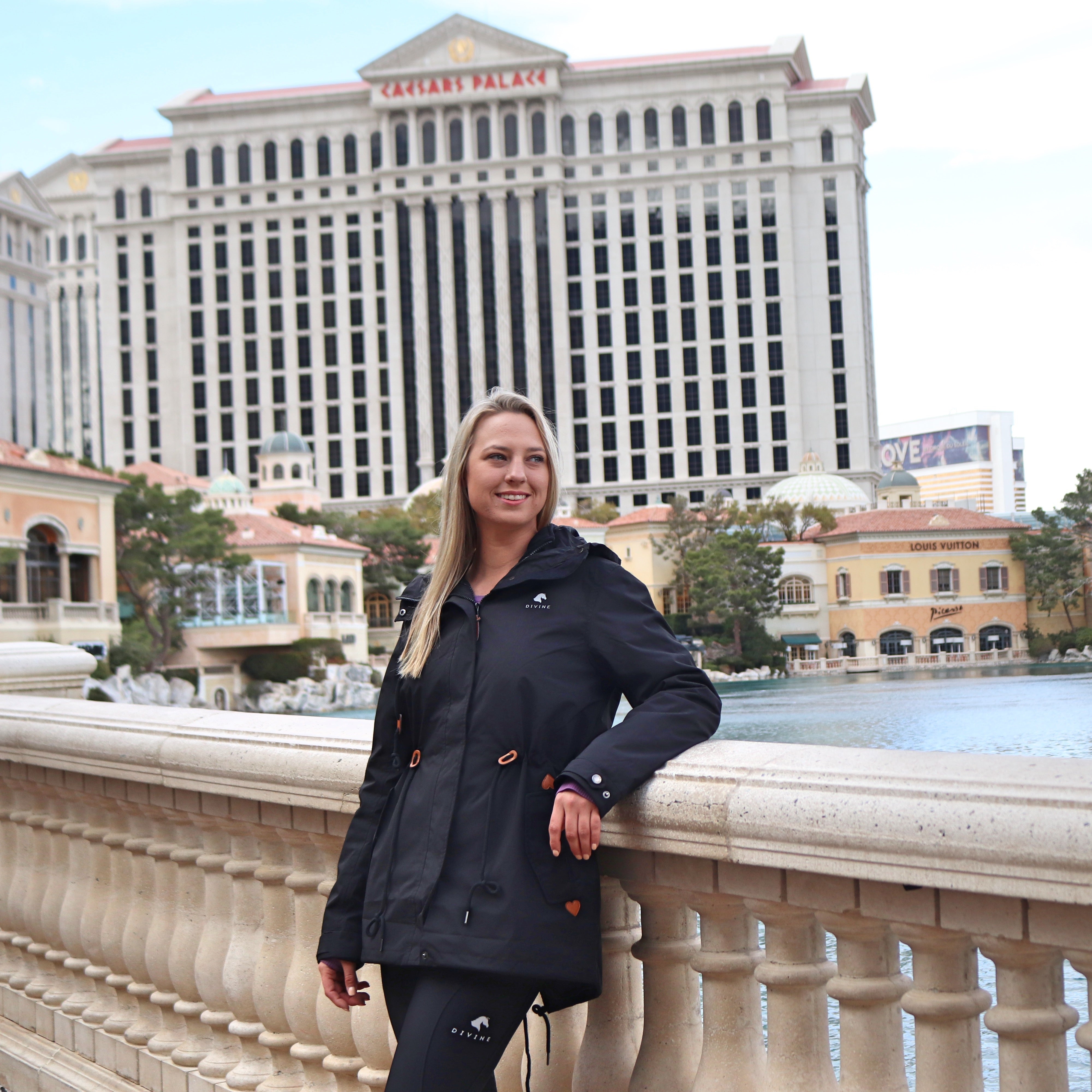 Divine Equestrian 2 in 1 Total Comfort Jacket - Black in front of Caesars Palace